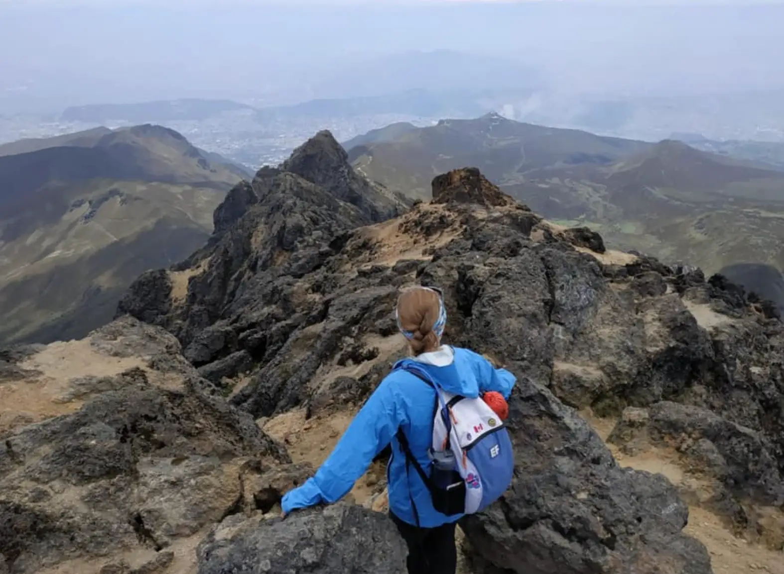 The writer hiking up a volcano in Ecuador.