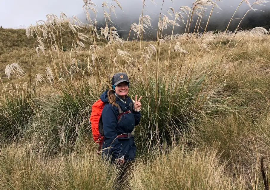The writer posing on a cloudy hike in the Ecuador Highlands.