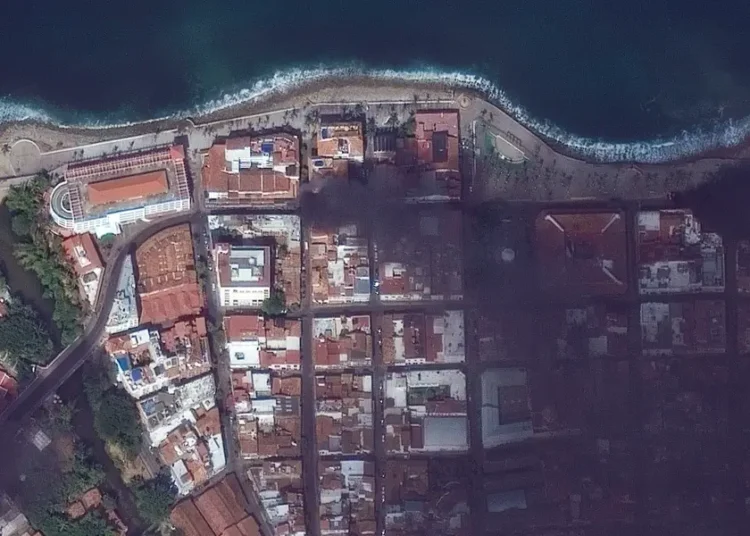 Satellite images show fires, roadblocks, and cars burning in a Costco parking lot after cartel violence in Mexico