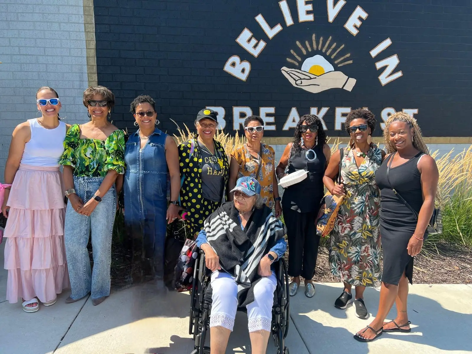Group of women smiling outside
