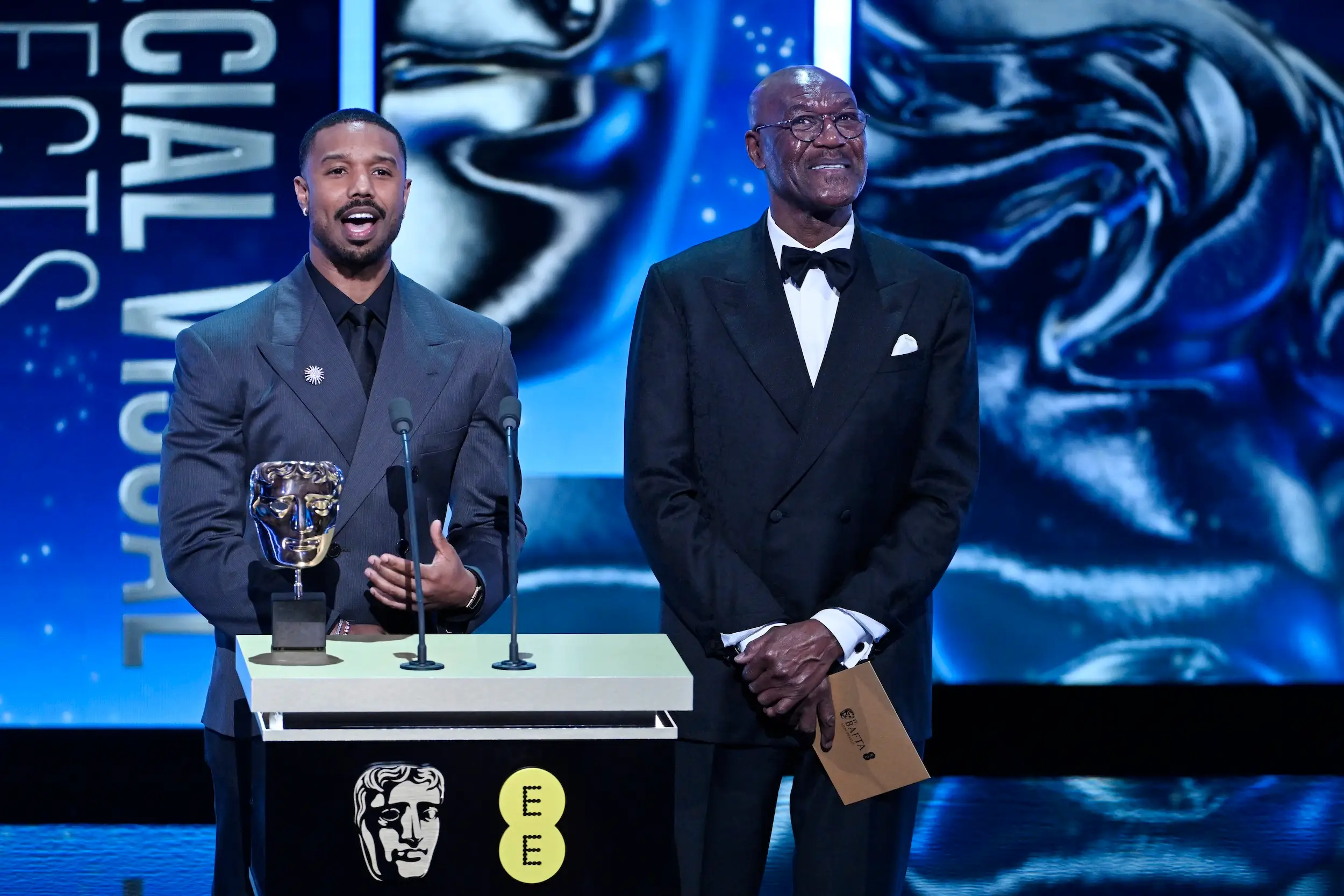 Actors Michael B. Jordan and Delroy Lindo are seen on stage at the BAFTAs