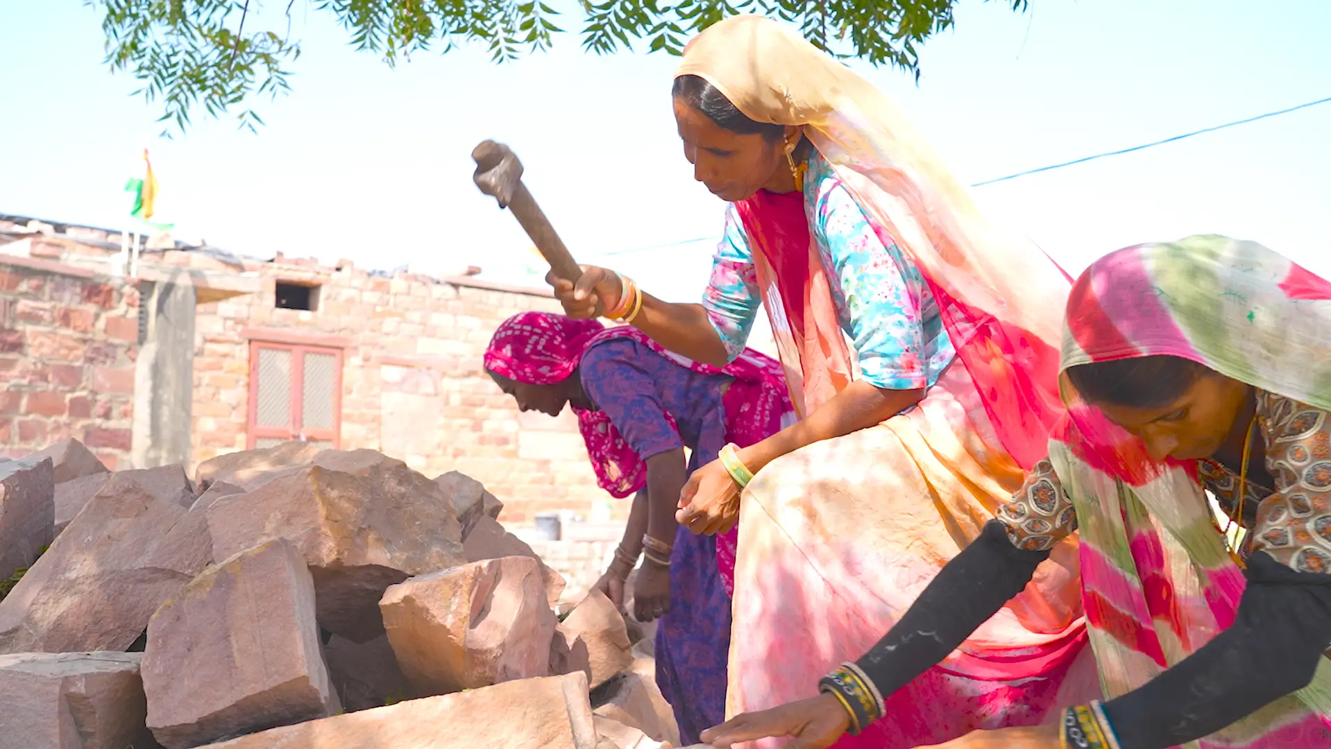 Sapna breaking stones in India.