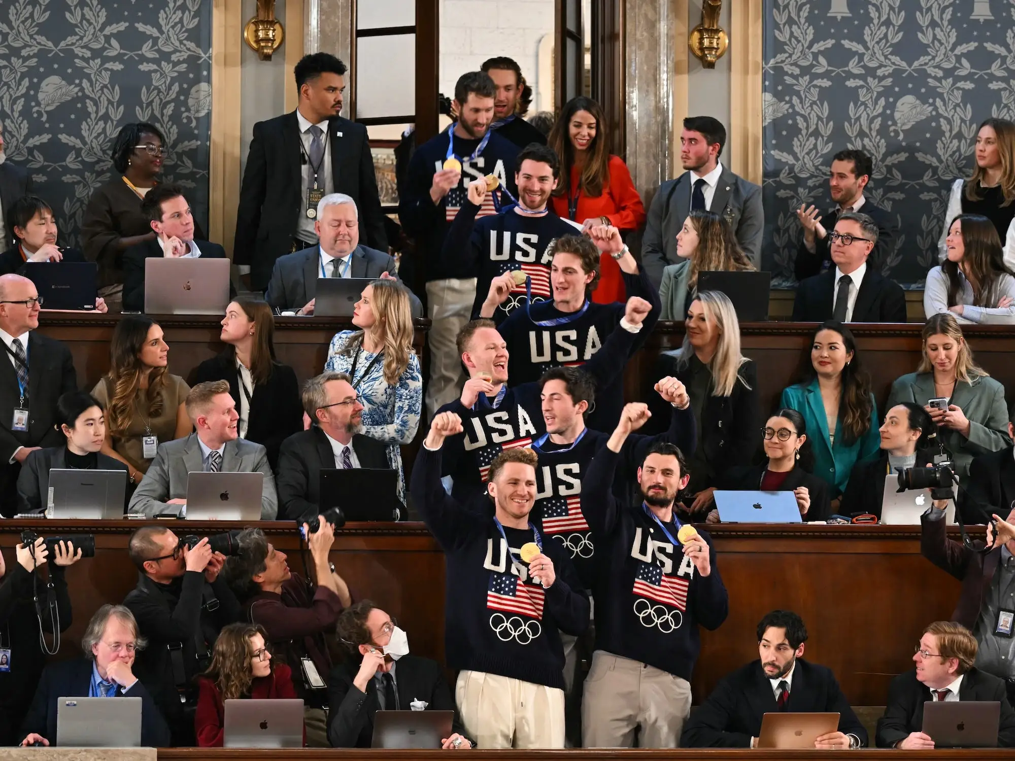 Members of the US Men's Hockey team in the press gallery at the State of the Union.