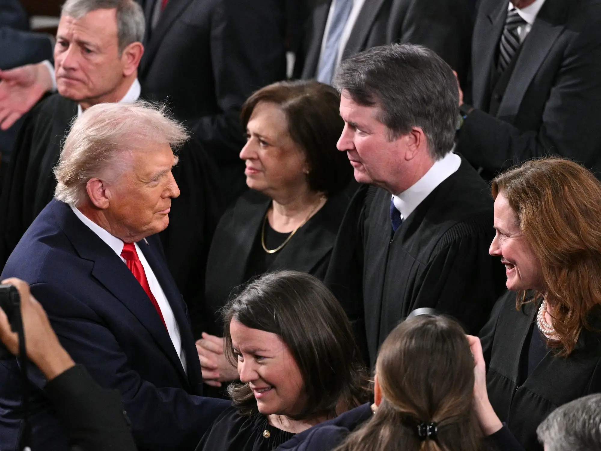 Trump shaking hands with Supreme Court justices at the State of the Union.