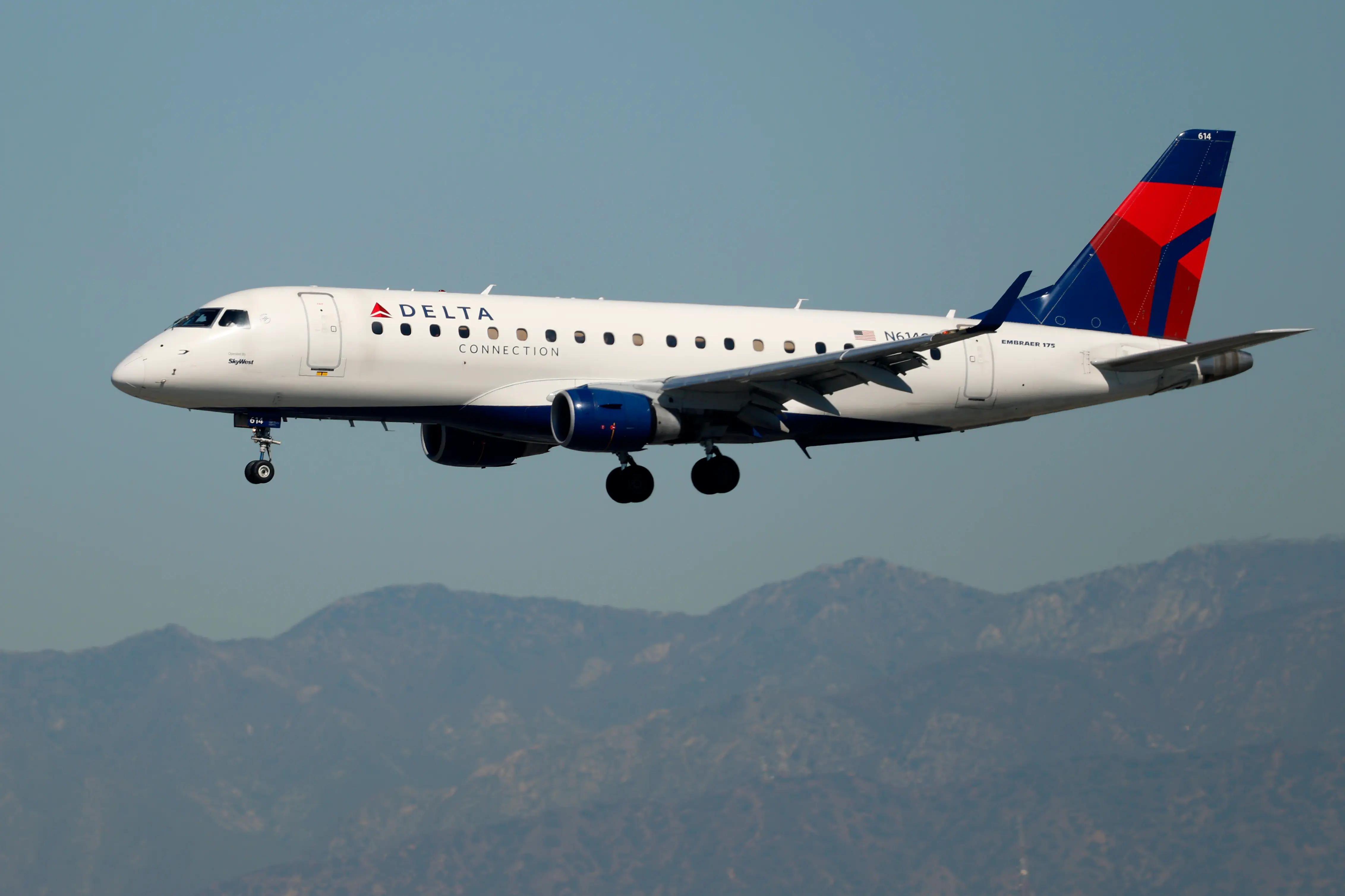 A Delta Connection SkyWest Airlines Embraer E175LR aircraft approaches Los Angeles International Airport for a landing from San Jose on October 17, 2025 in Los Angeles, California.