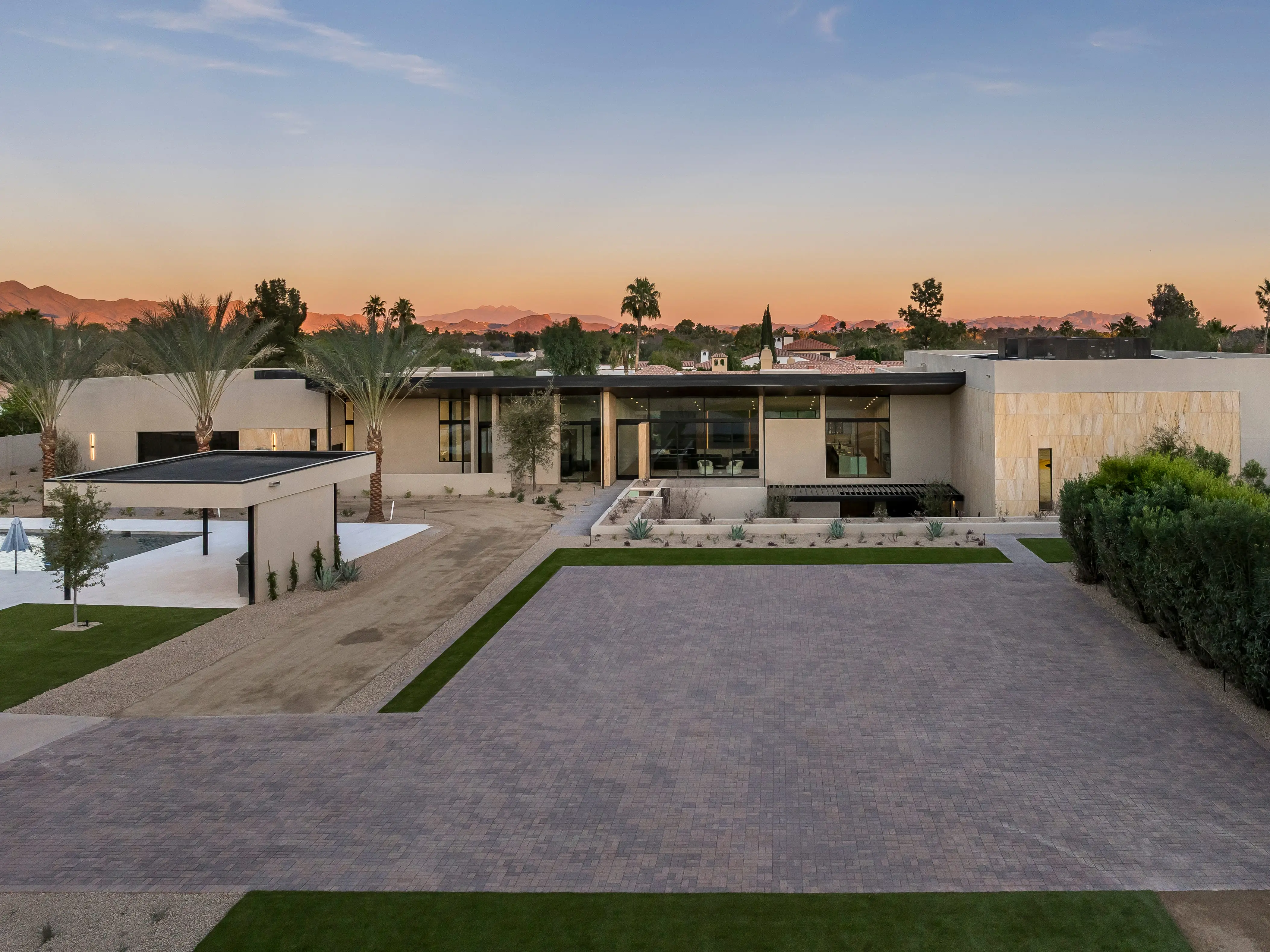 Exterior of 7545 N Mockingbird Lane at sunset.