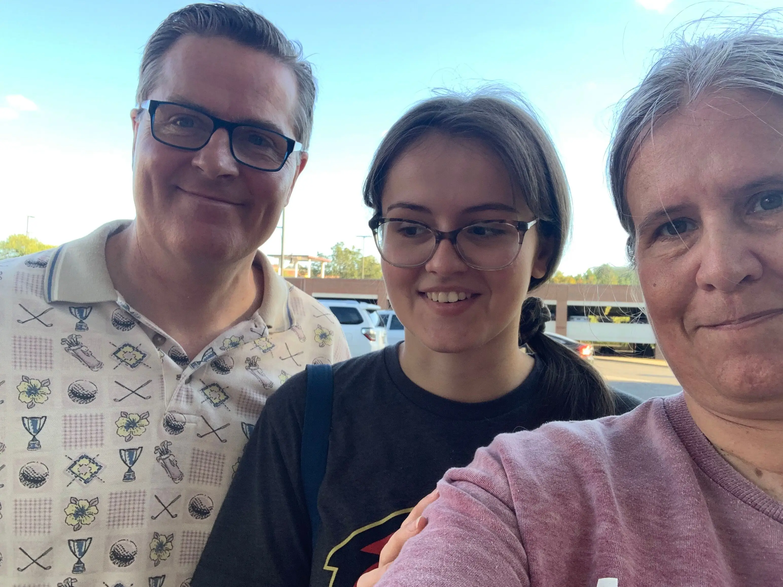 Three people smiling