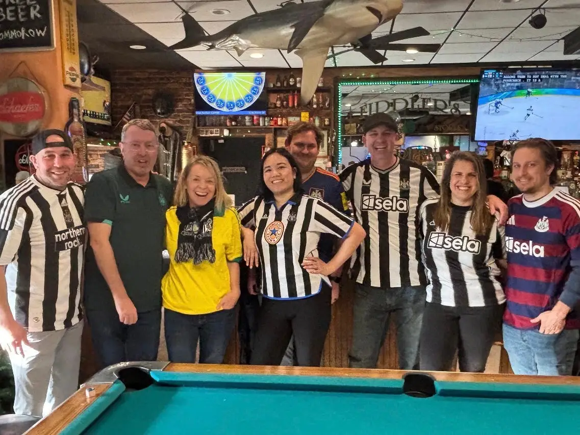 A group of soccer fans in a bar