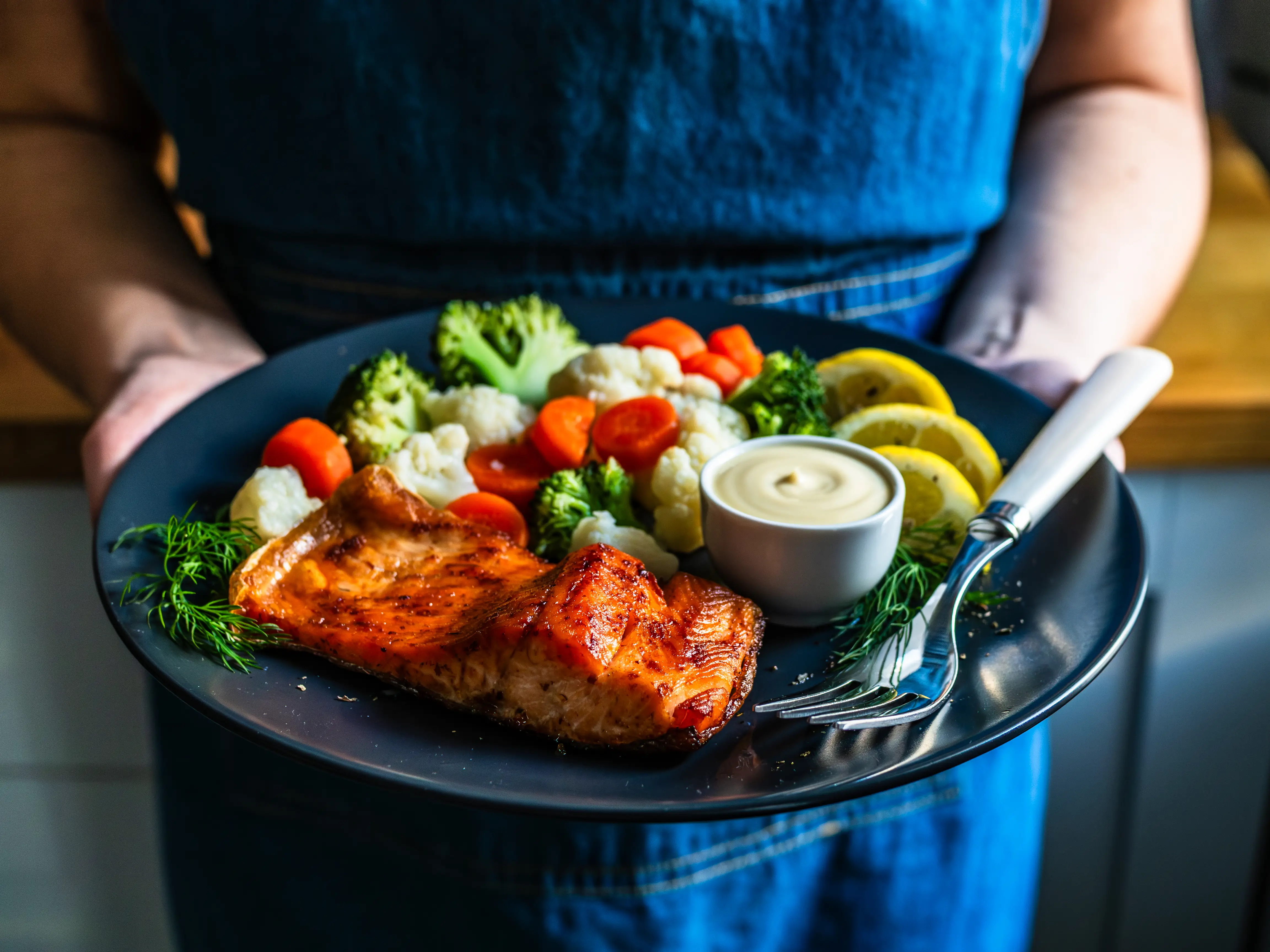 plate of food with veggies and fish