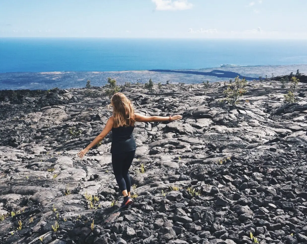 Woman standing on sand in Hawaii