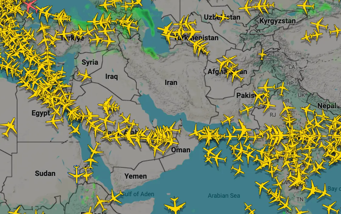 A flight-tracking map shows airplanes avoiding Iran and Iraq following military strikes on 28 February 2026