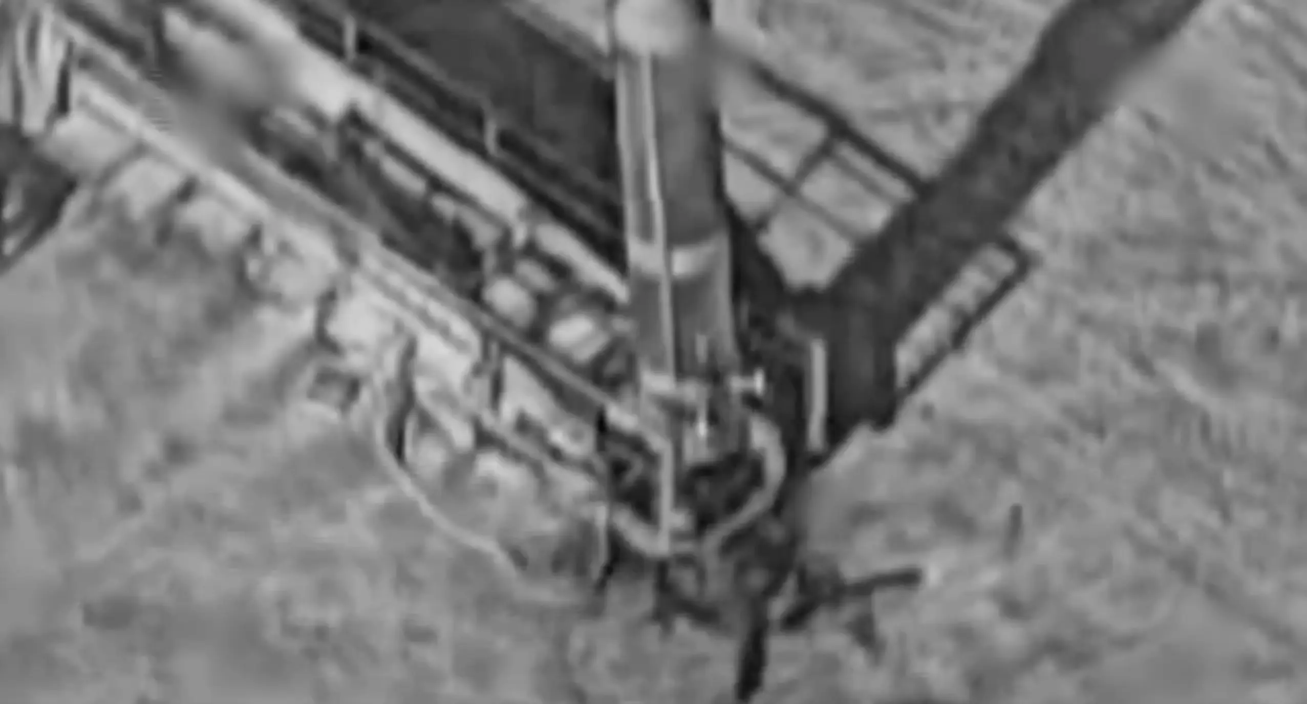 An infrared or thermal camera looks over a missile launcher.