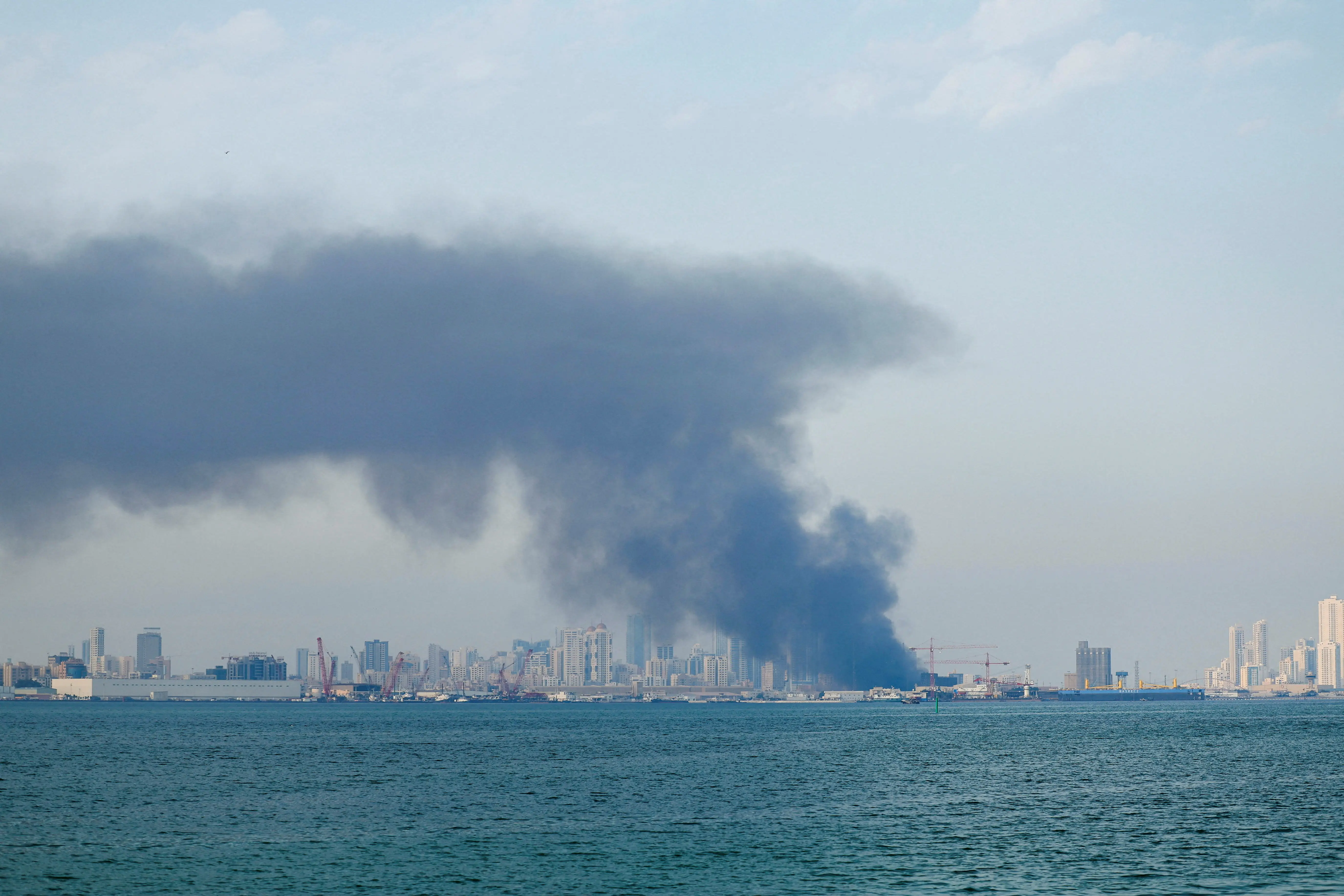 Smoke rises after reported Iranian missile attacks, following strikes by the United States and Israel against Iran, in Manama, Bahrain, February 28, 2026.