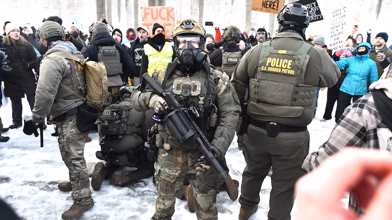 Protestors clash with federal agents outside the Bishop Henry Whipple Federal Building in Saint Paul, Minnesota
