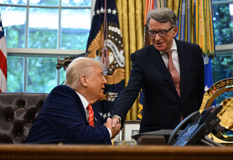 US President Donald Trump shakes hands with British ambassador to the United States Peter Mandelson  after making a trade announcement in the Oval Office of the White House in Washington, DC, on May 8, 2025. US President Donald Trump on Thursday announced a "full and comprehensive" trade agreement with Britain, which would be the first such deal since he launched his global tariffs blitz. (Photo by Jim WATSON / AFP) (Photo by JIM WATSON/AFP via Getty Images)