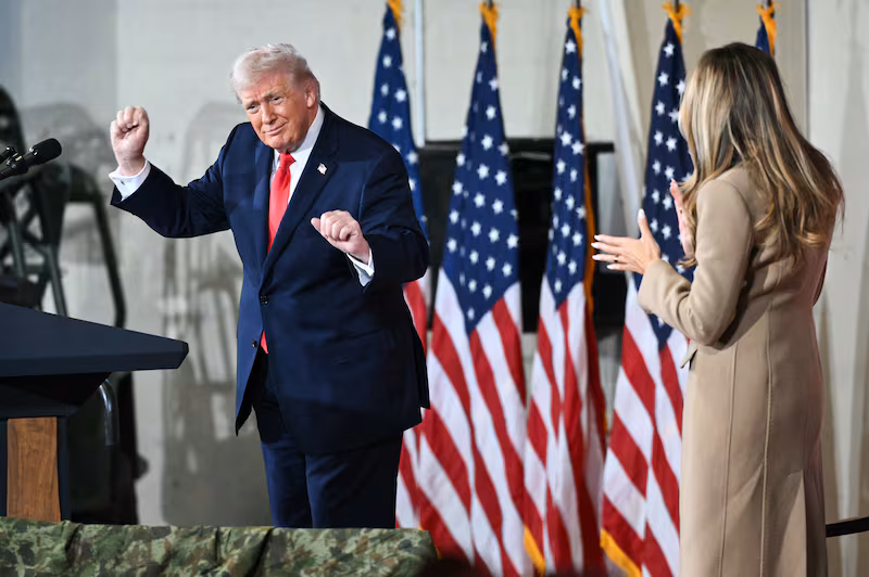 Donald Trump dances on stage next to Melania