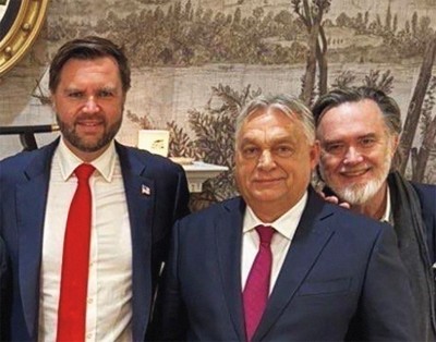 photo of vice president in red tie and blue suit next to Orbán in magenta tie and blue suit, with bearded Dreher smiling from behind Orbán's left shoulder