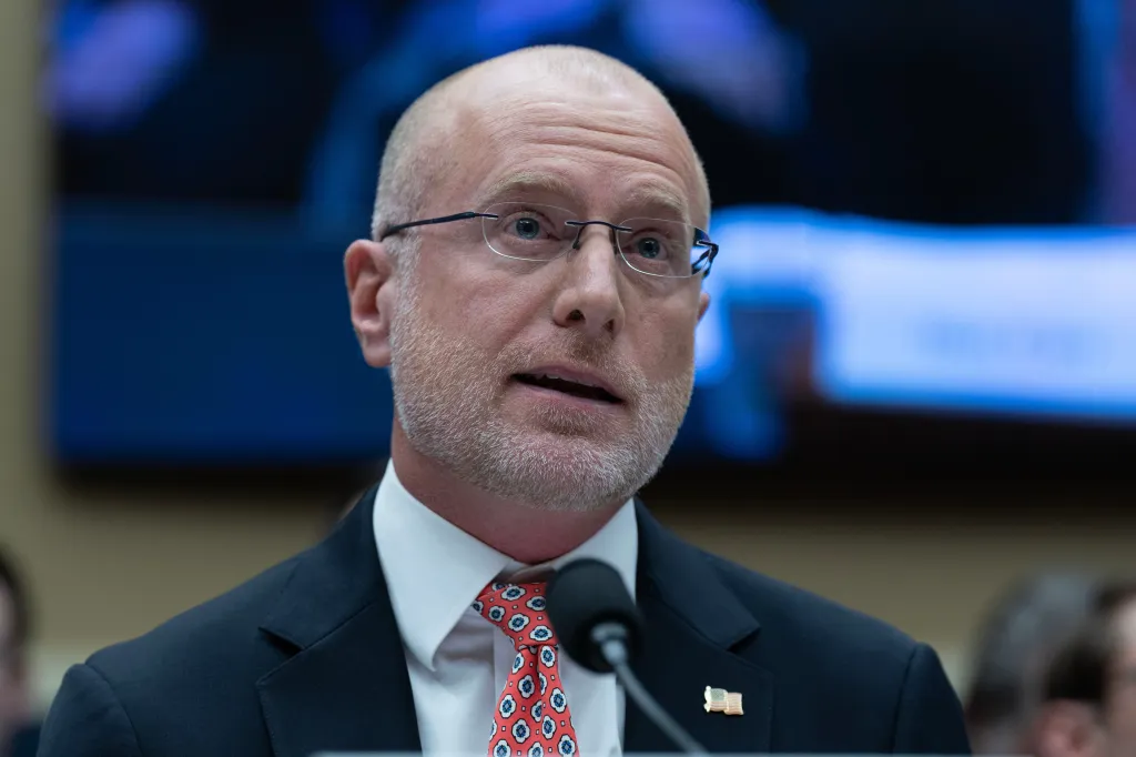 Brendan Carr speaking at a microphone.