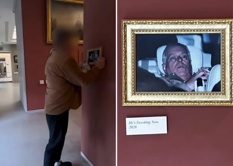 Infamous photo of ex-Prince Andrew after his arrest hung in the Louvre by activists, stuns visitors