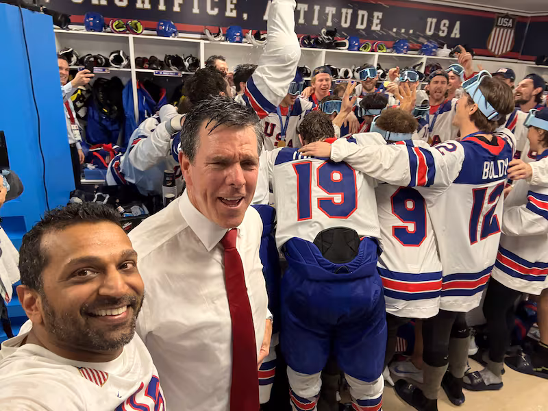 Kash Patel celebrates with Team USA after the men's hockey team wins gold at the Winter Olympics.