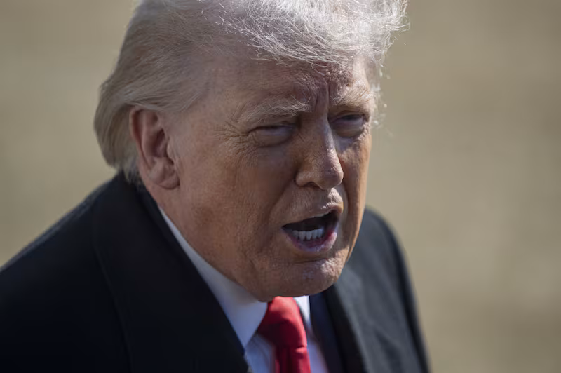 Donald Trump speaks to the press before departing from the White House en route to Fayetteville, North Carolina, on February 13, 2026, in Washington, DC.