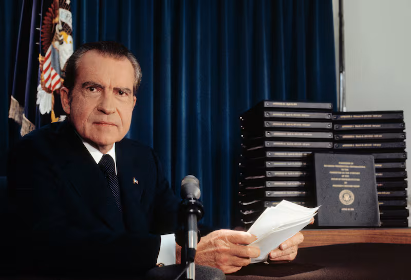 President Richard Nixon said he will turn over 1,200 pages of edited transcripts about Watergate scandal to the House Judiciary Committee that, he said, would clear him of any involvement and will "tell it all". The stack of transcripts to be turned over are in the background.