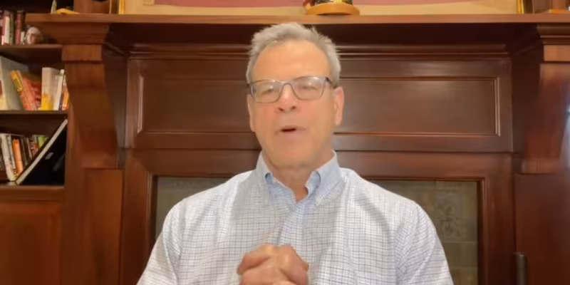 Kurt Olsen is being interviewed.