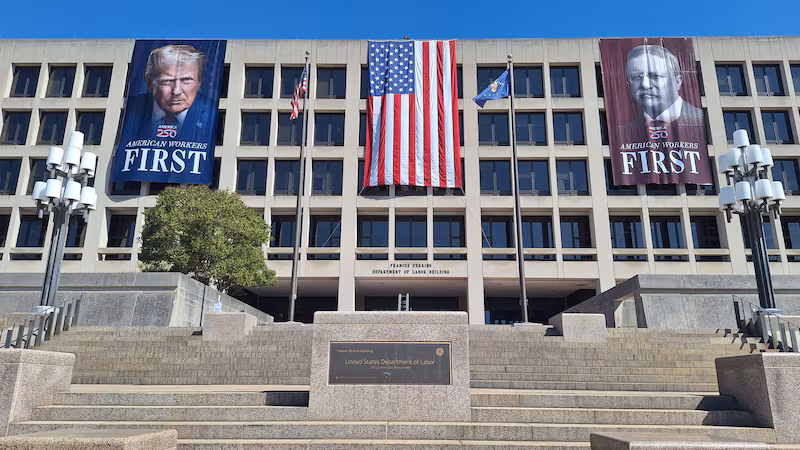 The Department of Labor building, displaying a banner of Donald Trump and Theodore Roosevelt.