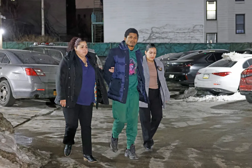 Dayvon Morrison escorted by two women.