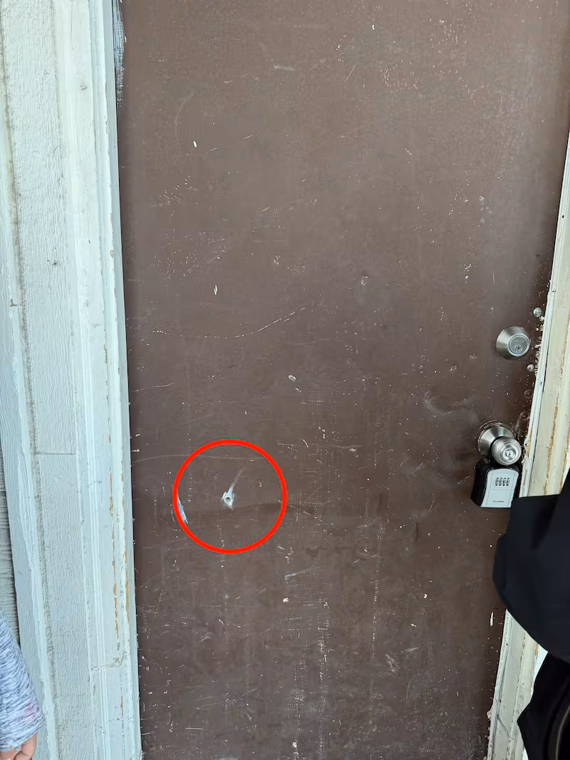 Bullet hole in door