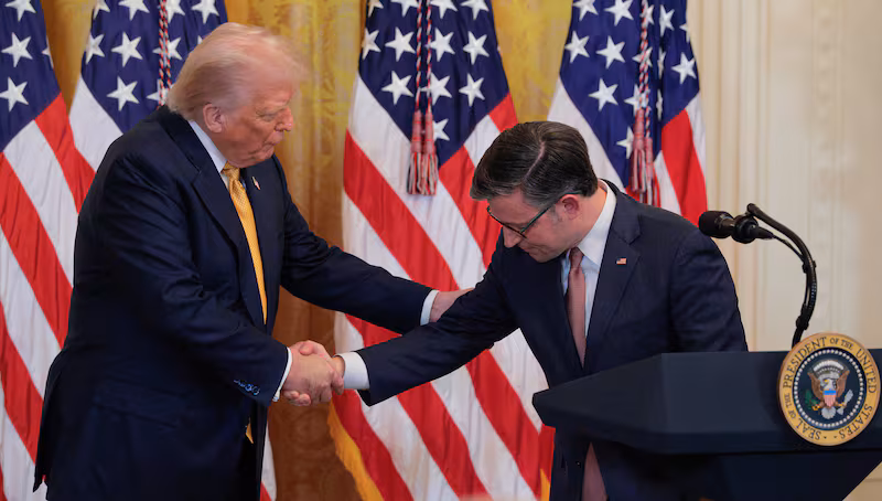 President Donald Trump and House Speaker Mike Johnson shake hands at a reception for Republican members of the House of Representatives in the East Room of the White House on July 22, 2025 in Washington, DC.