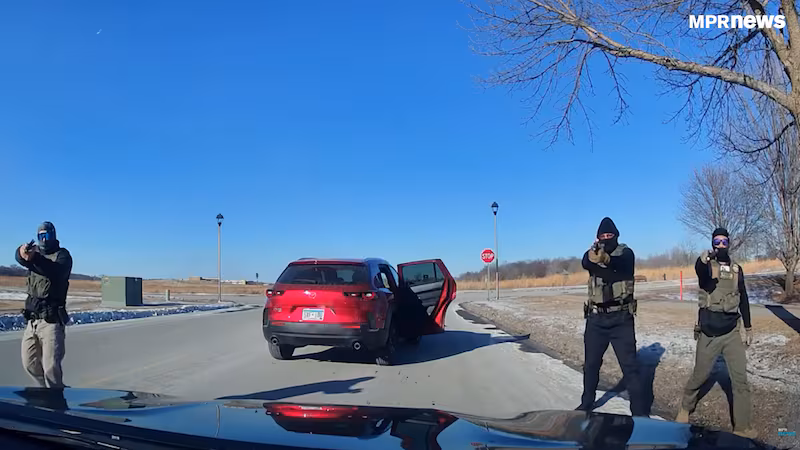 ICE agents stop an unarmed woman in St. Peter, Minnesota.
