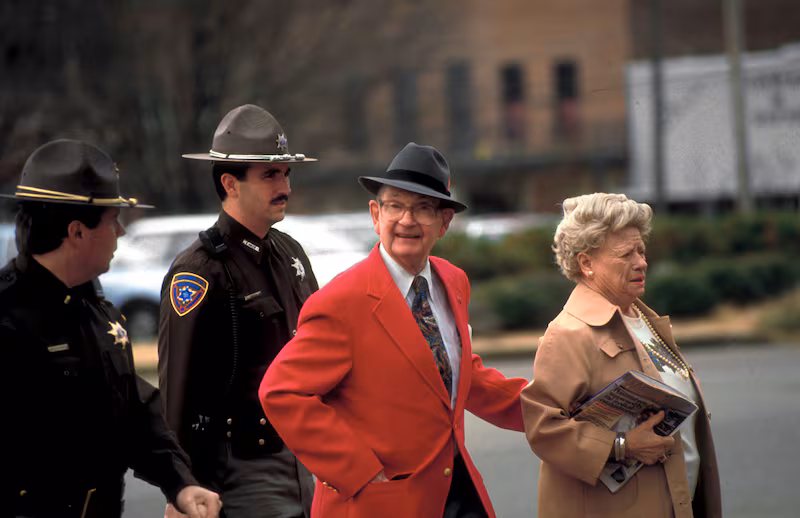 State troopers escorting Byron de la Beckwith and his wife to court during his 3rd trial for the 1963 murder of civil rights activist Medgar Evers.