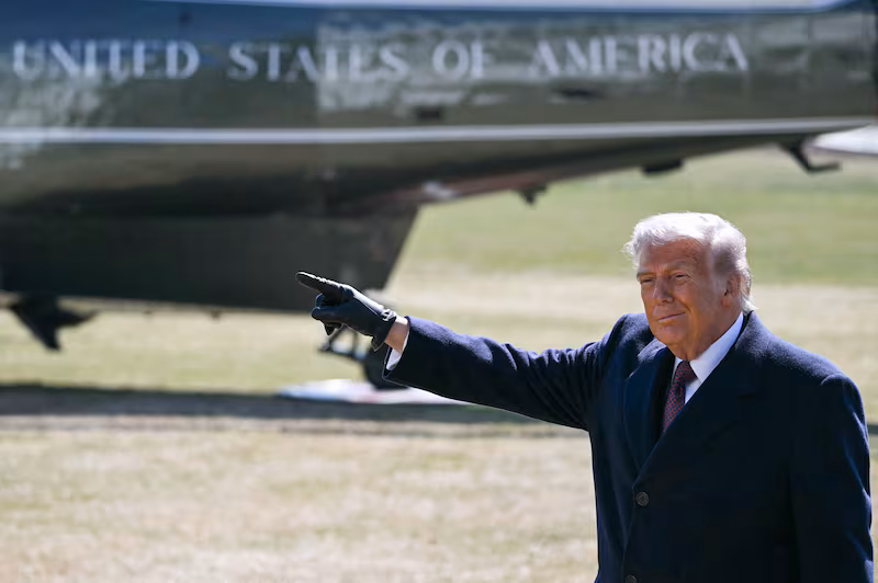 US President Donald Trump gestures as he walks to board Marine One as he departs the South Lawn of the White House for Texas in Washington, DC, on February 27, 2026. President Trump is traveling to Corpus Christi, Texas, to deliver remarks on energy. (Photo by ANDREW CABALLERO-REYNOLDS / AFP via Getty Images)