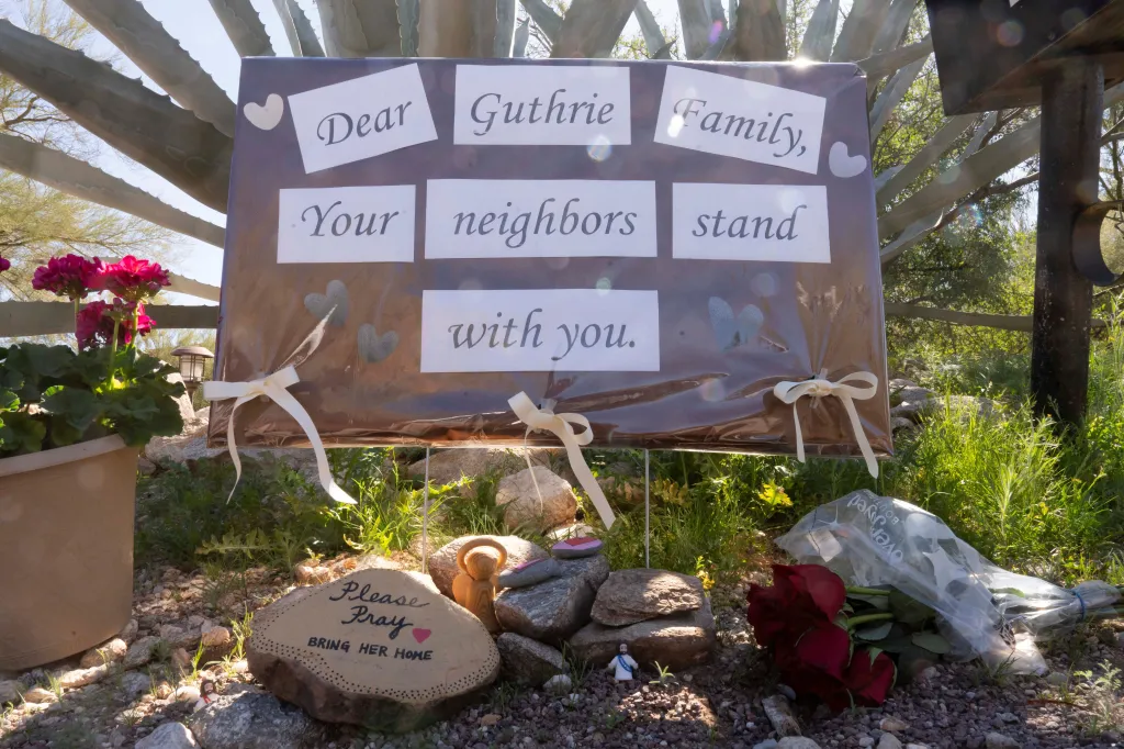 A sign and other objects showing support from neighbors is posted at the home of Nancy Guthrie, the 84-year-old mother of U.S. journalist and television host Savannah Guthrie, who went missing from her home in Tucson, U.S. February 9, 2026.