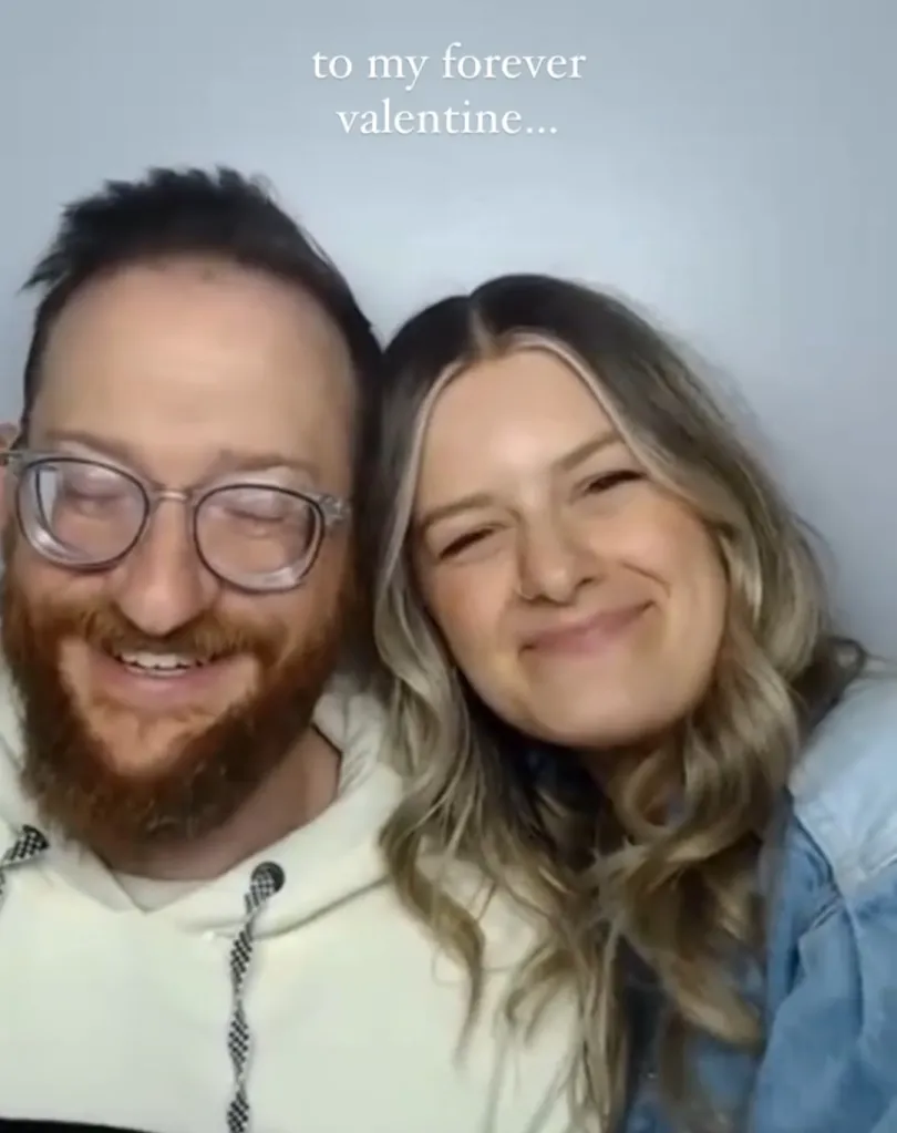 A man with glasses and a beard and a woman with long blonde hair smile at the camera, with text above them reading 