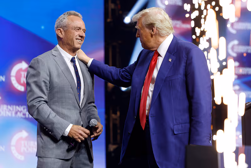 DULUTH, GEORGIA - OCTOBER 23: Republican presidential nominee, former U.S. President Donald Trump welcomes Robert F. Kennedy Jr. to the stage at a Turning Point Action campaign rally at the Gas South Arena on October 23, 2024 in Duluth, Georgia. Trump is campaigning across Georgia today as he and Democratic presidential nominee, U.S. Vice President Kamala Harris attempt to win over swing state voters. (Photo by Anna Moneymaker/Getty Images)