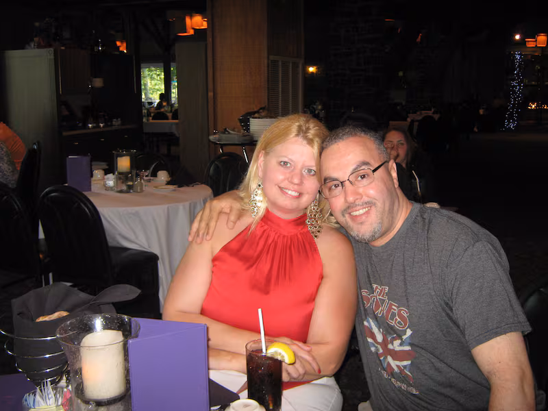 Sandra and Abdellatif Hafraoui sat at a table.