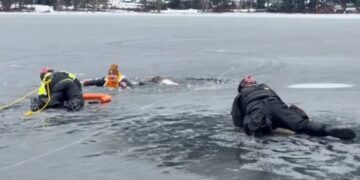 Washington man falls through ice into frigid lake — right in front of cops practicing water rescues