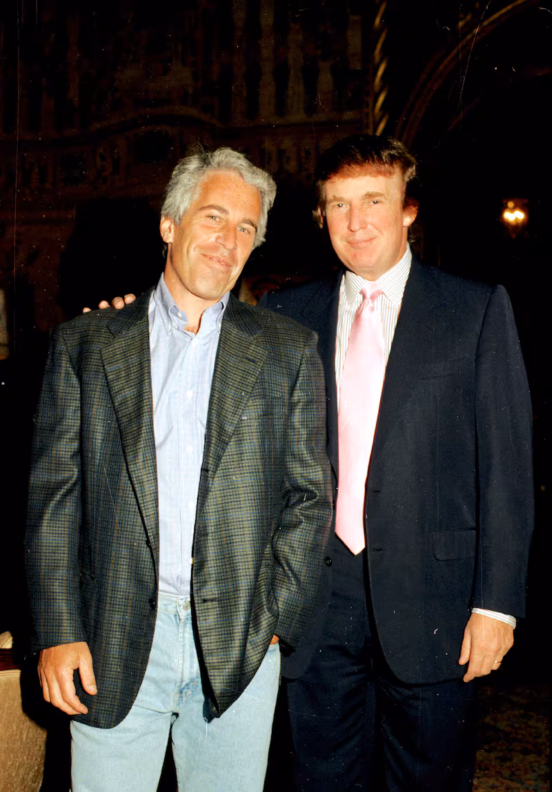 Jeffrey Epstein (left) and Donald Trump as they pose together at the Mar-a-Lago estate, Palm Beach, Florida on February 22, 1997.