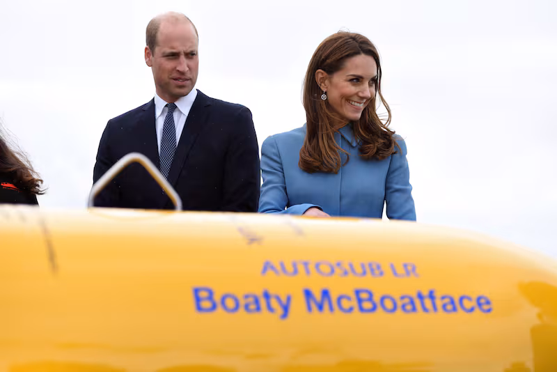 Britain's Catherine, Duchess of Cambridge (R) and Britain's Prince William, Duke of Cambridge react as they stand near the unmanned submarine 'Boaty McBoatface',