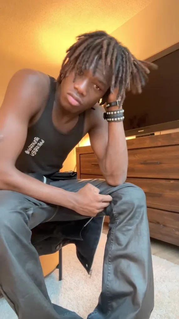 Abdallah Diaby sitting and looking at the camera.