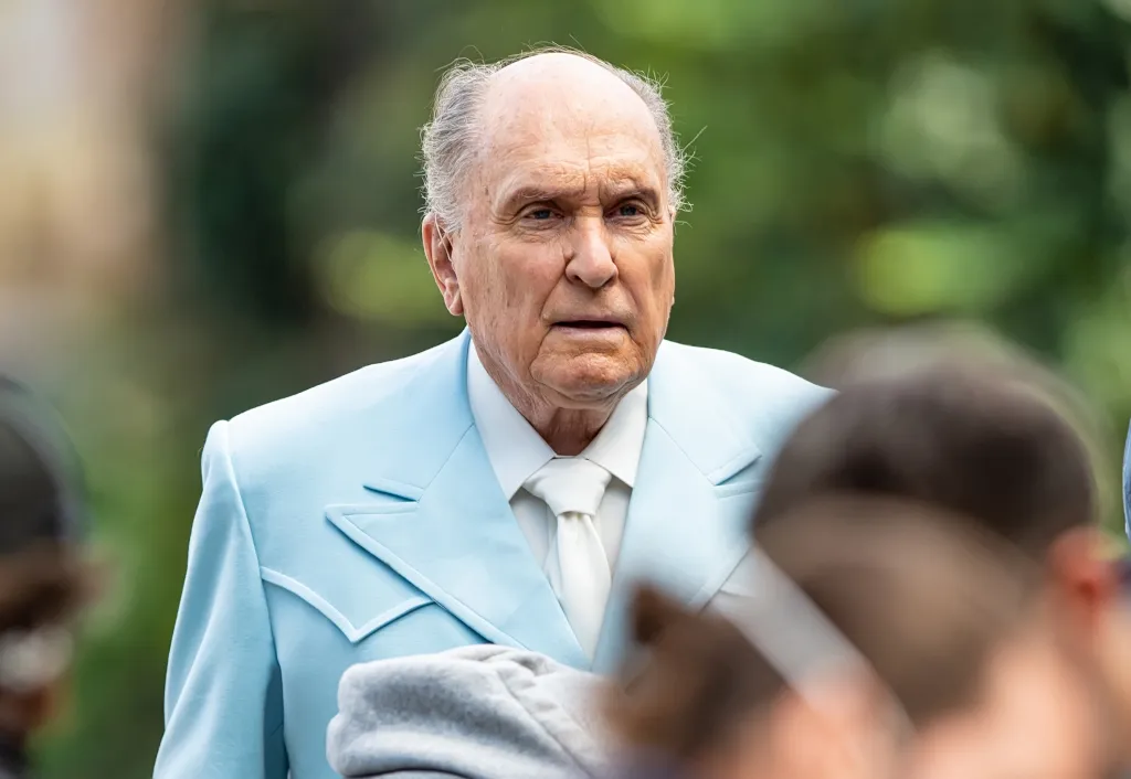 Actor Robert Duvall in a light blue suit and white tie filming scenes for the Netflix film 