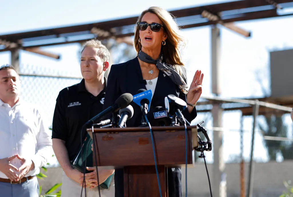 SBA Administrator Kelly Loeffler speaks at a press conference with EPA Administrator Lee Zeldin looking on.