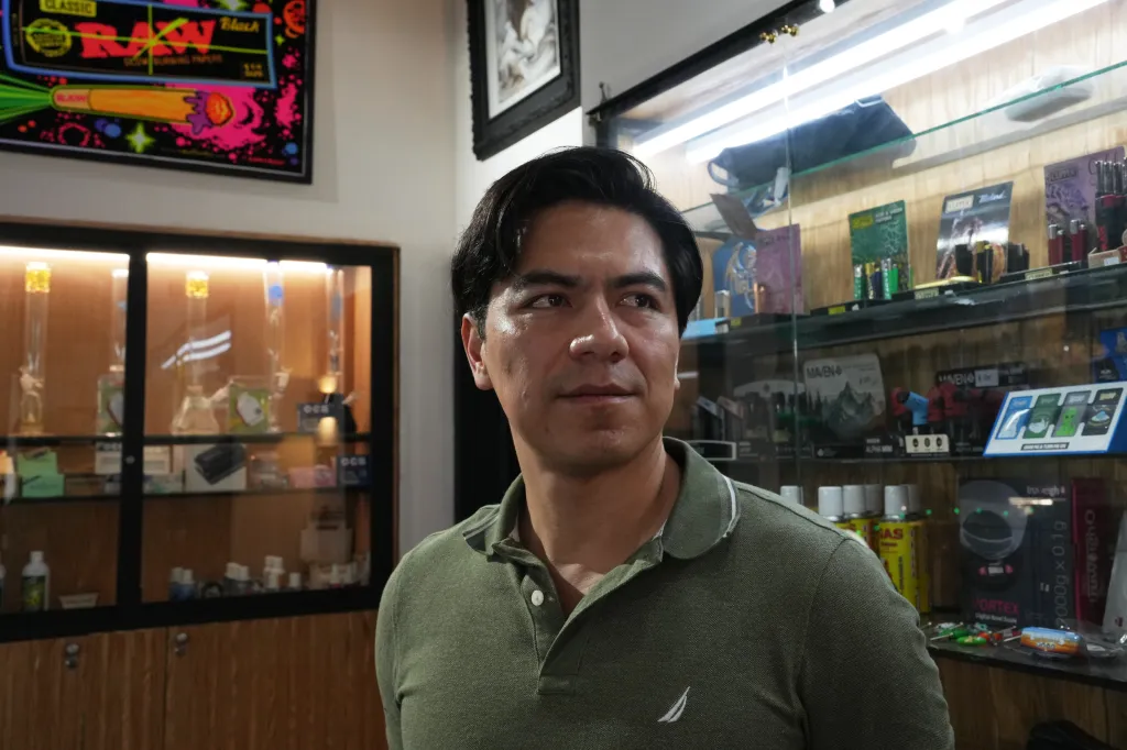 Aldo Martínez, owner of a tobacco shop that previously sold vapes, poses for a photo in Mexico City.