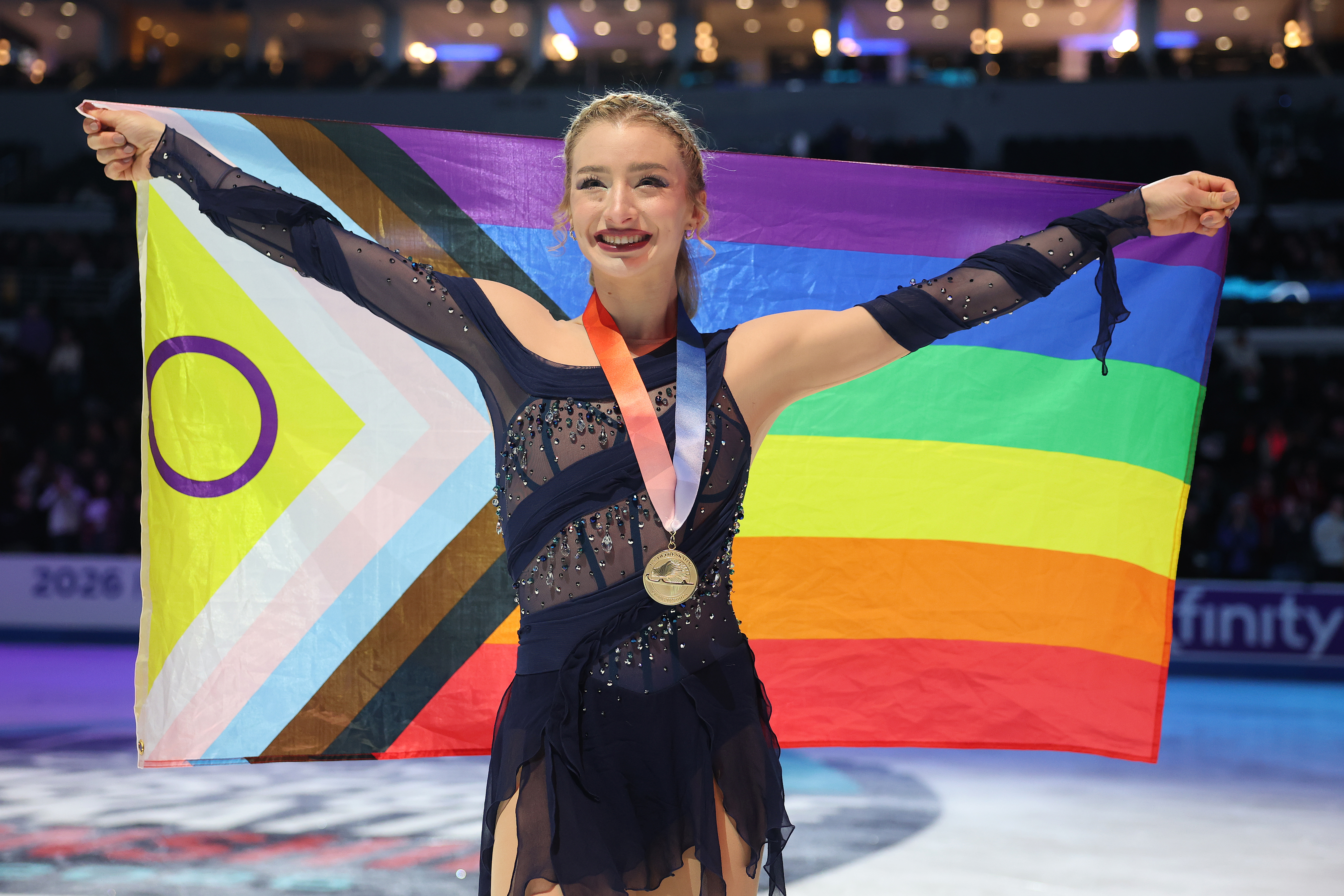 Amber Glenn poses with a Pride flag after competing in the U.S. Figure Skating Championships on Jan. 09, 2026 in St. Louis, Mo. 