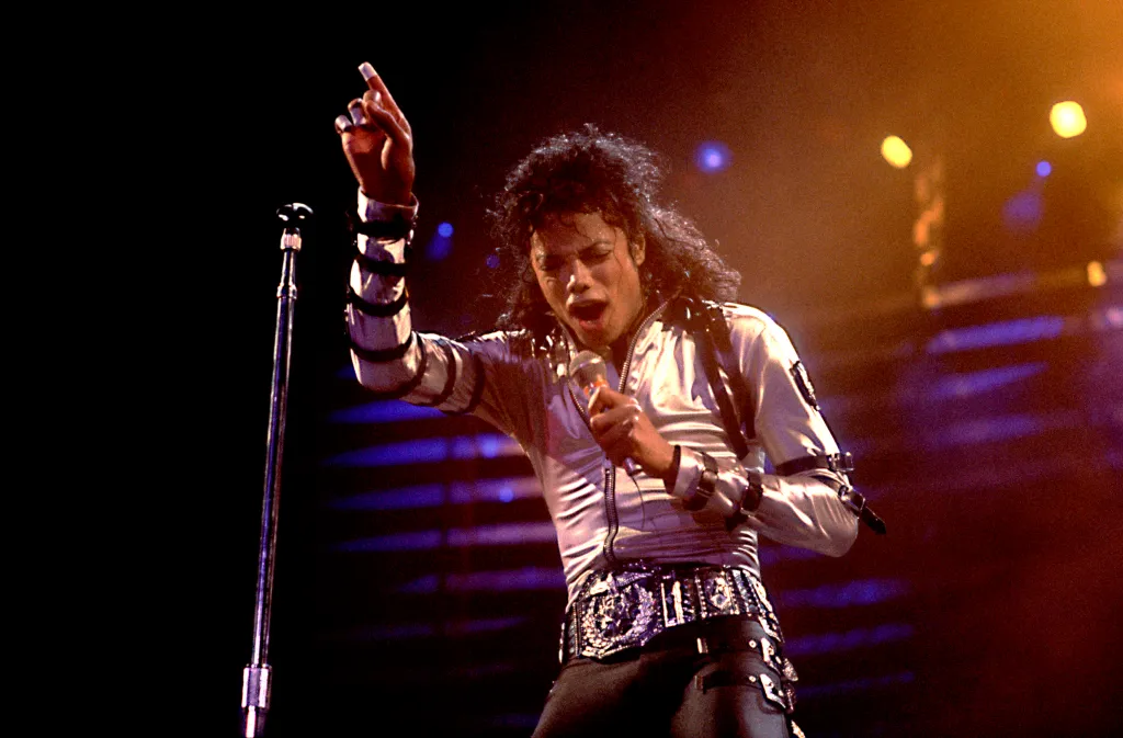 Michael Jackson performing on stage during his 'BAD' tour.