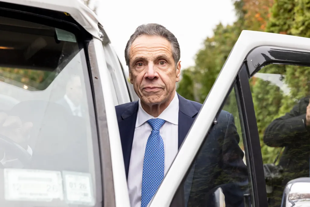 Andrew Cuomo exiting a vehicle.