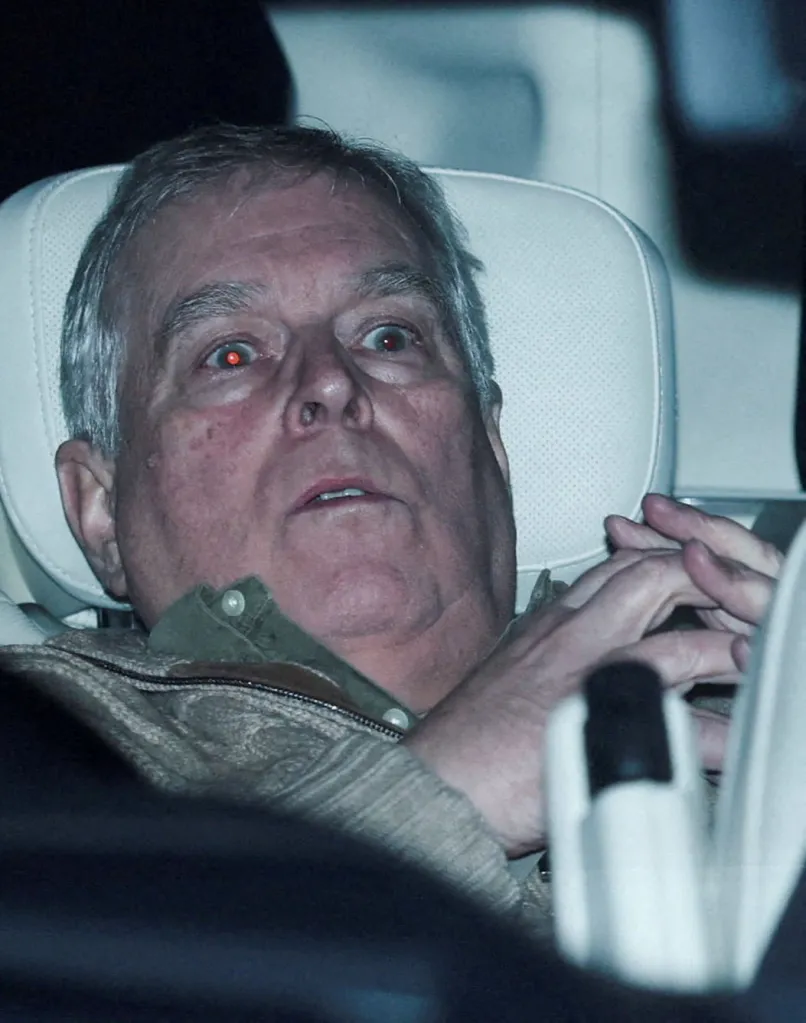 Andrew Mountbatten Windsor in a vehicle after being arrested on suspicion of misconduct.