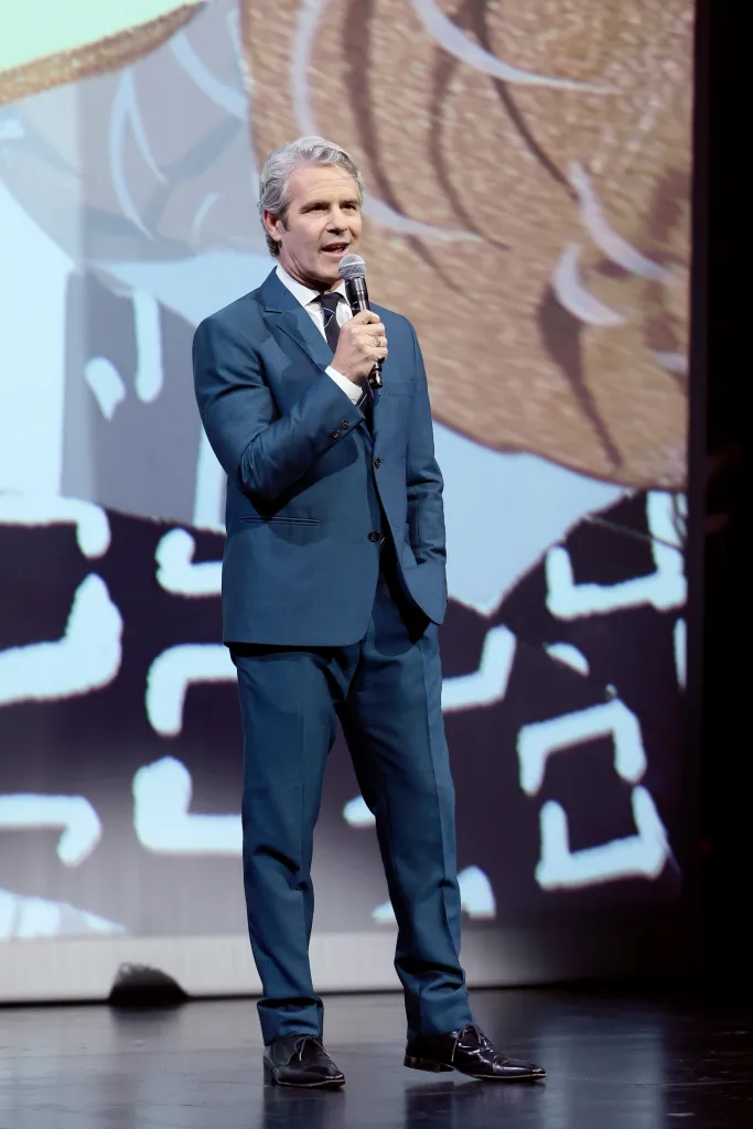 Andy Cohen speaking onstage.